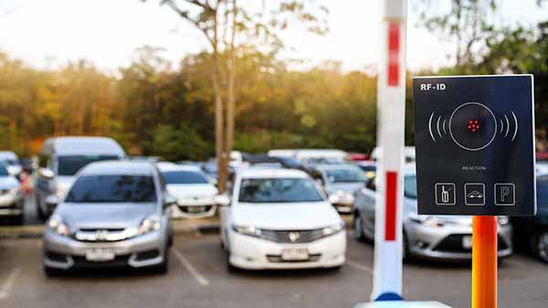 RFID system in a parking lot. The system uses radio waves to verify the identity of the people in the lot. This can be used to improve security and efficiency in parking lots.